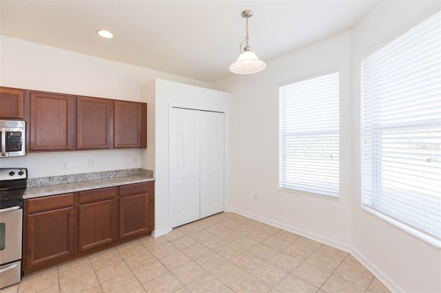 kitchen featuring decorative light fixtures and stainless steel appliances