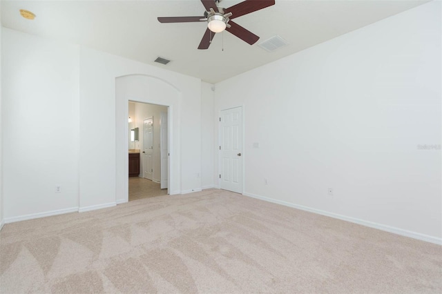 unfurnished room featuring ceiling fan and light colored carpet