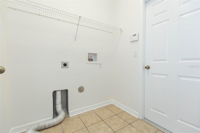 clothes washing area with electric dryer hookup, light tile patterned floors, and hookup for a washing machine