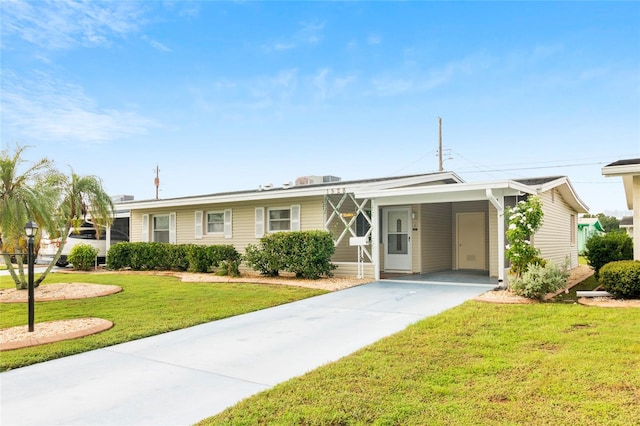 ranch-style house featuring a carport and a front lawn