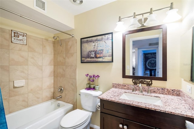 full bathroom featuring vanity, toilet, and tiled shower / bath