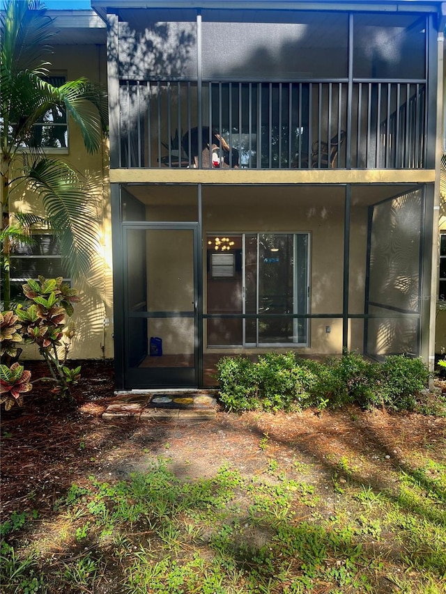 rear view of property featuring a balcony