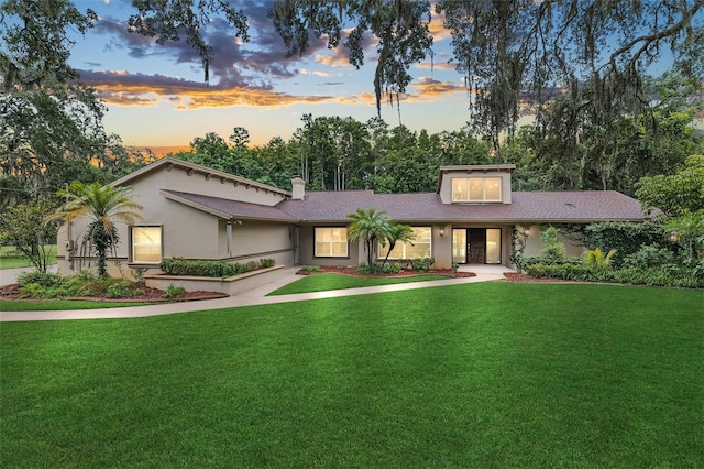 view of front of house with a yard