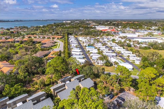 bird's eye view featuring a water view and a residential view