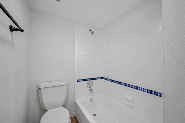 bathroom featuring toilet and shower / washtub combination