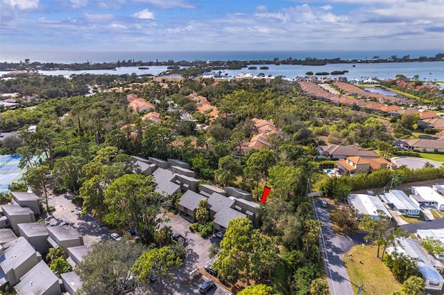 birds eye view of property featuring a water view and a residential view