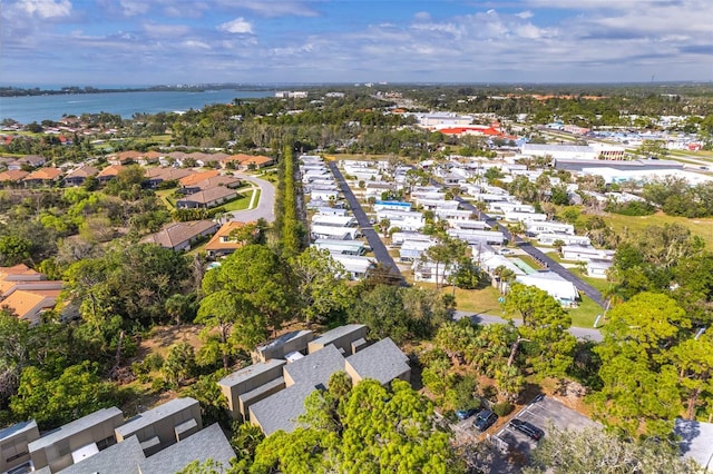 birds eye view of property featuring a water view and a residential view