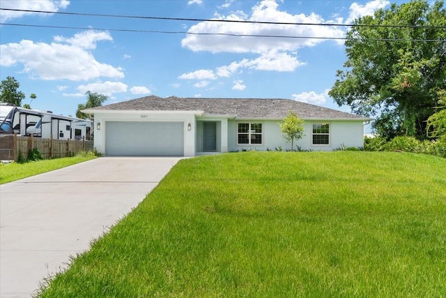 view of front facade featuring a garage and a front yard