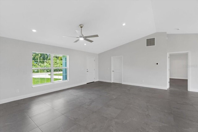 tiled spare room featuring ceiling fan and vaulted ceiling