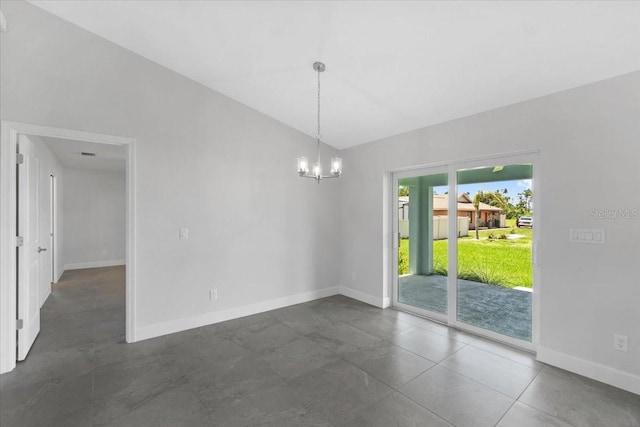 tiled spare room featuring an inviting chandelier and lofted ceiling