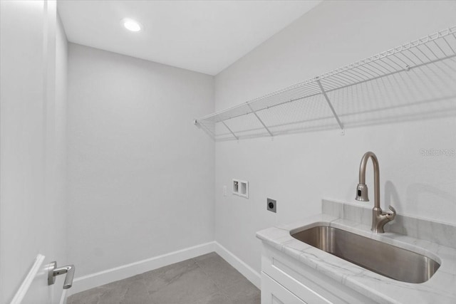 clothes washing area featuring sink, tile patterned flooring, cabinets, hookup for an electric dryer, and washer hookup