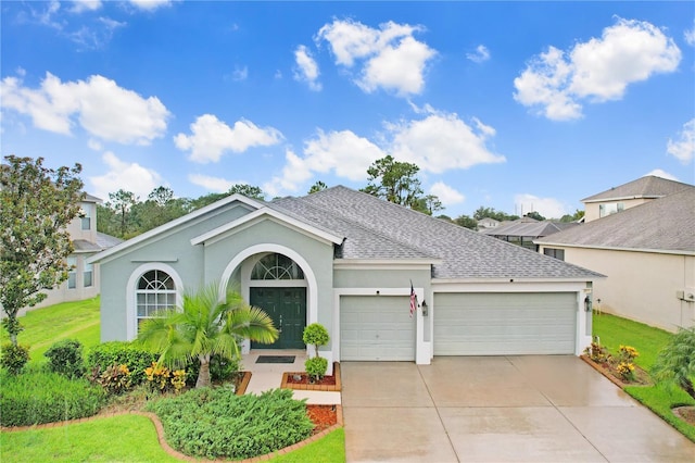 single story home with a front lawn and a garage