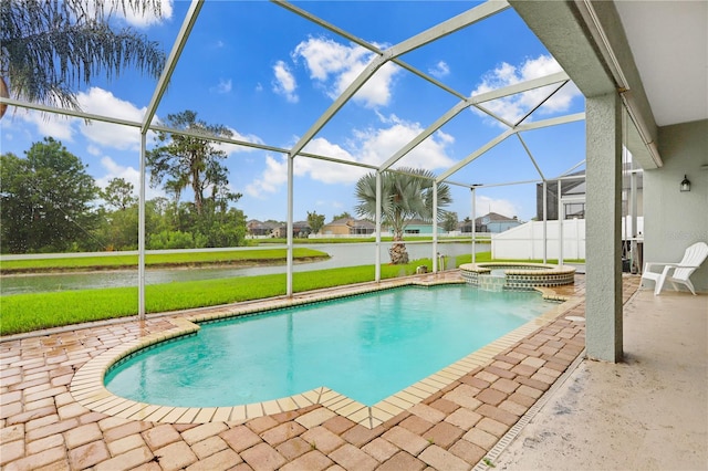 view of swimming pool with an in ground hot tub, glass enclosure, and a patio area