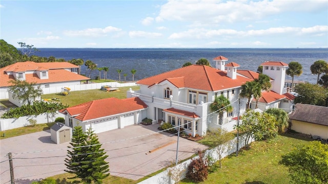 birds eye view of property featuring a water view