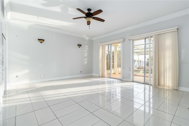 spare room featuring crown molding, light tile patterned floors, and ceiling fan