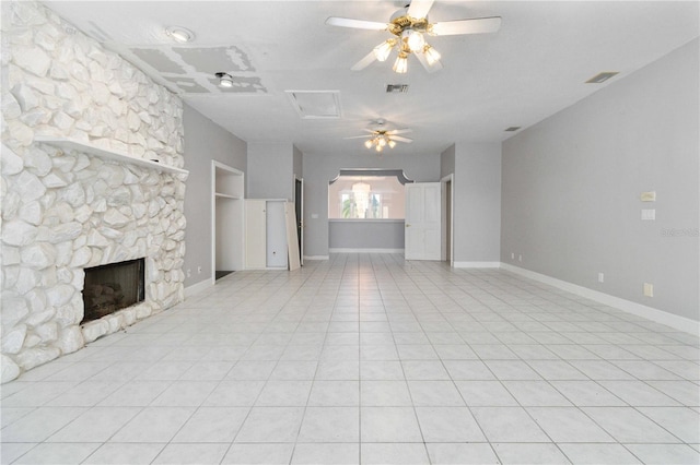 unfurnished living room featuring ceiling fan, light tile patterned floors, and a fireplace