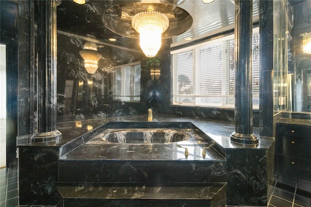 bathroom with vanity and decorative columns