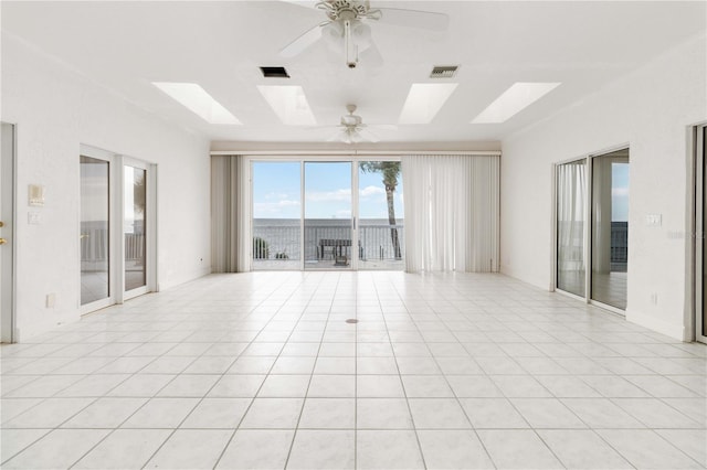 spare room with light tile patterned flooring and ceiling fan