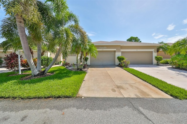 view of front of house featuring a garage and a front yard