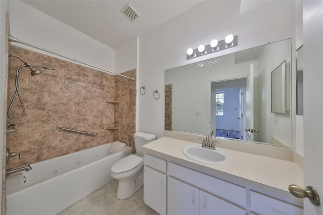 full bathroom with tile patterned floors, toilet, a textured ceiling, vanity, and tiled shower / bath combo