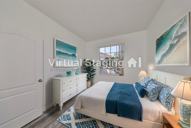 bedroom with wood-type flooring