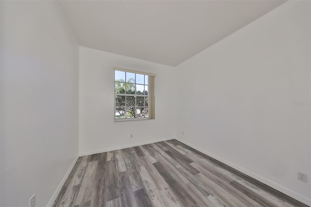 spare room with light hardwood / wood-style floors