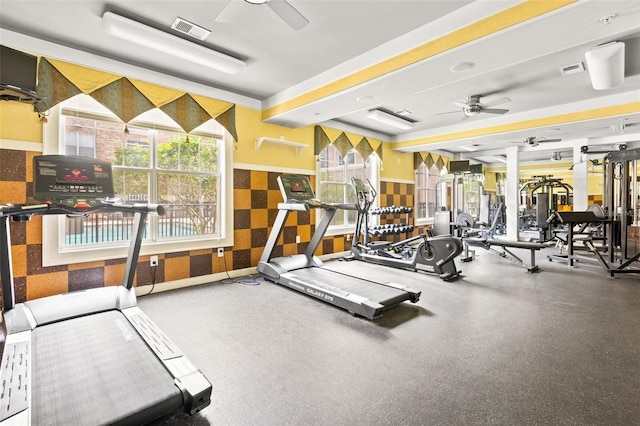 exercise room with ceiling fan