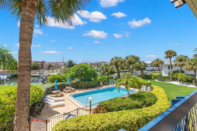 view of pool with a water view