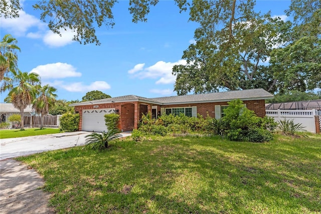 ranch-style home with a front yard and a garage