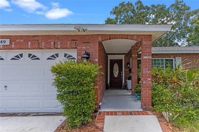 doorway to property featuring a garage