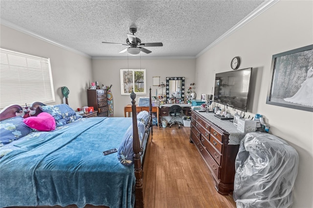 bedroom with hardwood / wood-style flooring, ceiling fan, crown molding, and a textured ceiling