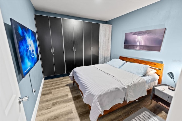 bedroom featuring hardwood / wood-style flooring