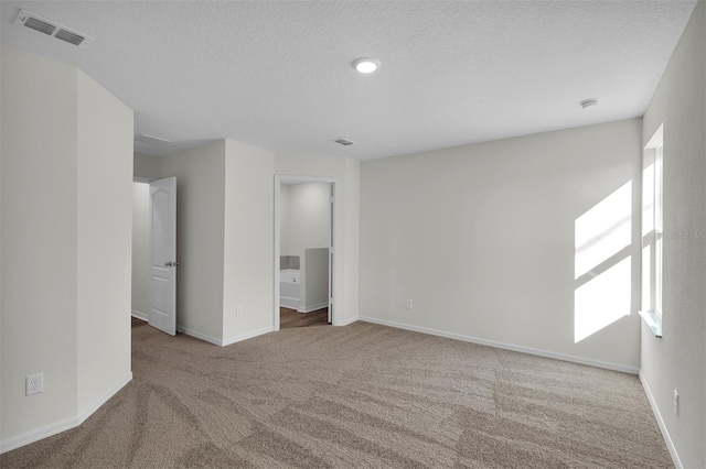 48 Prattwood Ln, Palm Coast, FL 32164 - unfurnished bedroom featuring visible vents, carpet flooring, and a textured ceiling