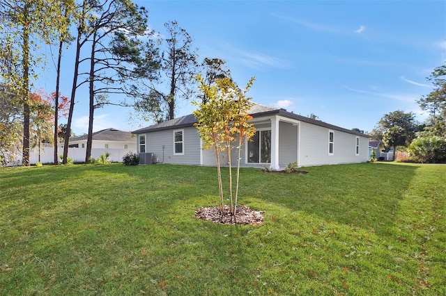 48 Prattwood Ln, Palm Coast, FL 32164 - back of house featuring a yard, fence, and cooling unit