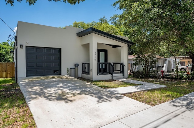 view of front facade featuring a garage and covered porch