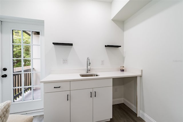 interior space featuring sink and hardwood / wood-style flooring