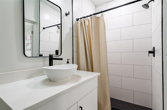 bathroom featuring vanity and a shower with shower curtain