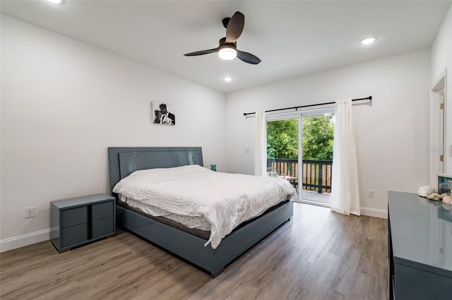 bedroom with access to outside, ceiling fan, and hardwood / wood-style floors