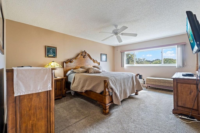 carpeted bedroom featuring a textured ceiling and ceiling fan