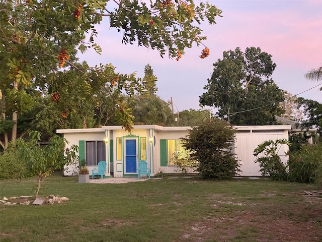 view of front of property with a lawn