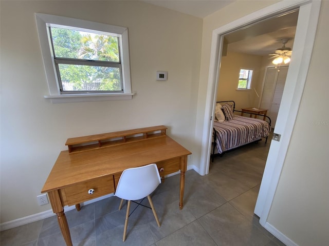 office space featuring tile patterned floors and ceiling fan