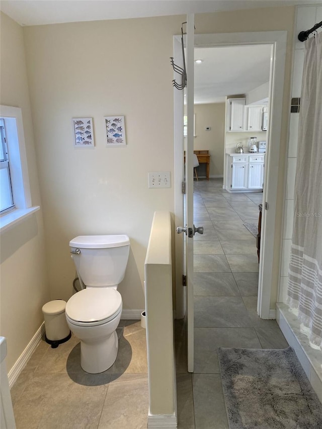 bathroom with tile patterned floors, toilet, and vanity