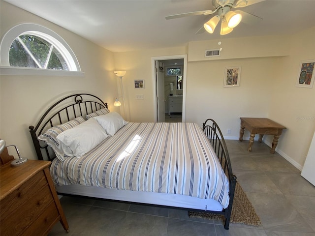 tiled bedroom with ceiling fan