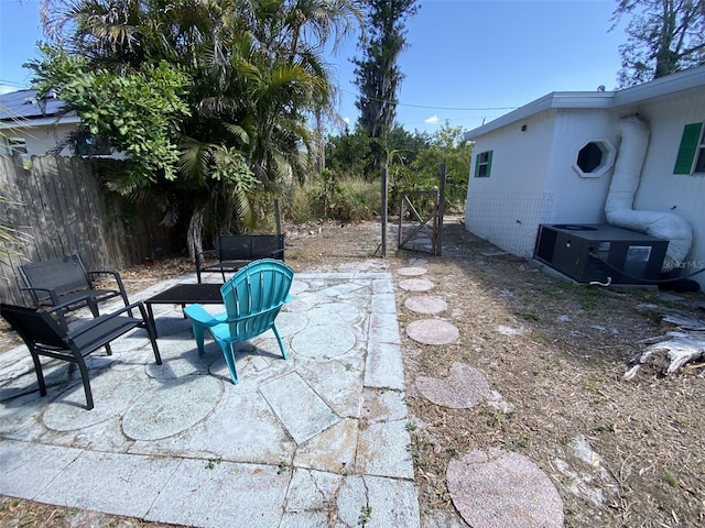 view of patio / terrace featuring central AC and an outdoor fire pit