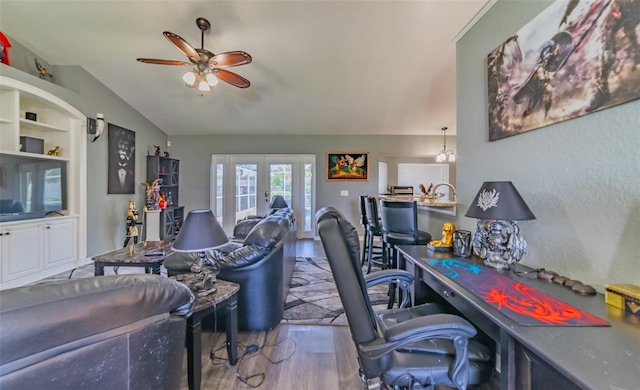 office space with ceiling fan, french doors, wood finished floors, and vaulted ceiling