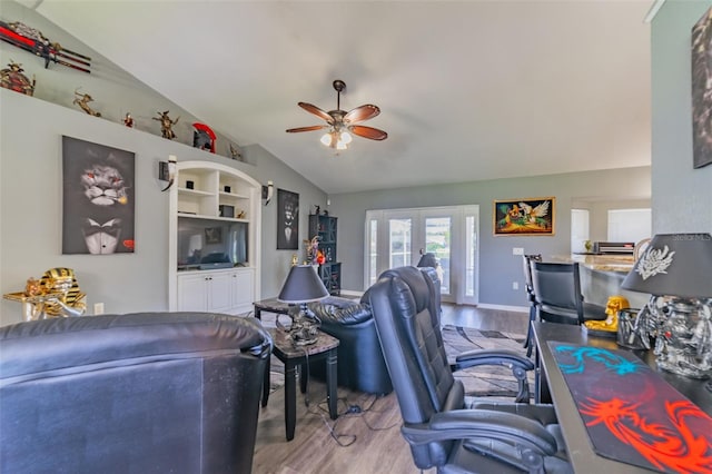 office with vaulted ceiling, wood finished floors, french doors, and ceiling fan