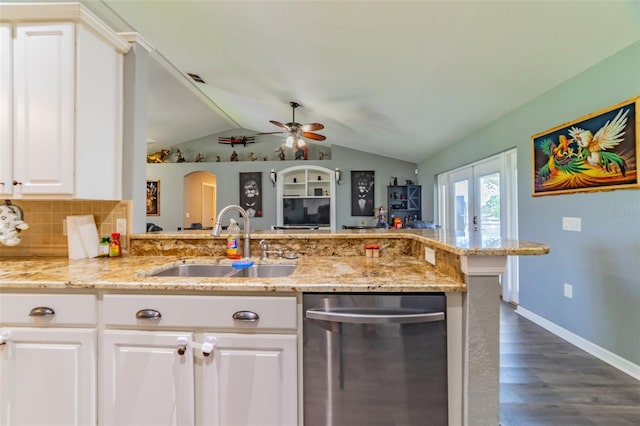 kitchen with a sink, decorative backsplash, white cabinets, french doors, and dishwasher