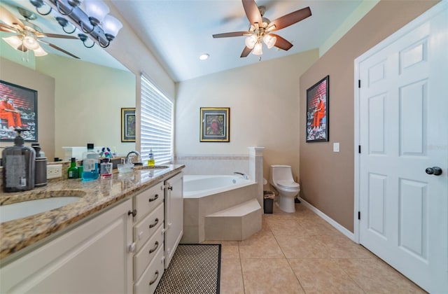 full bathroom featuring tile patterned flooring, toilet, a garden tub, double vanity, and a sink