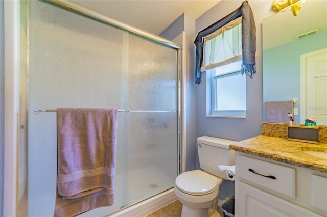 full bath featuring visible vents, toilet, a stall shower, and vanity