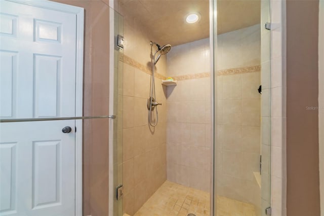 full bath with a shower stall